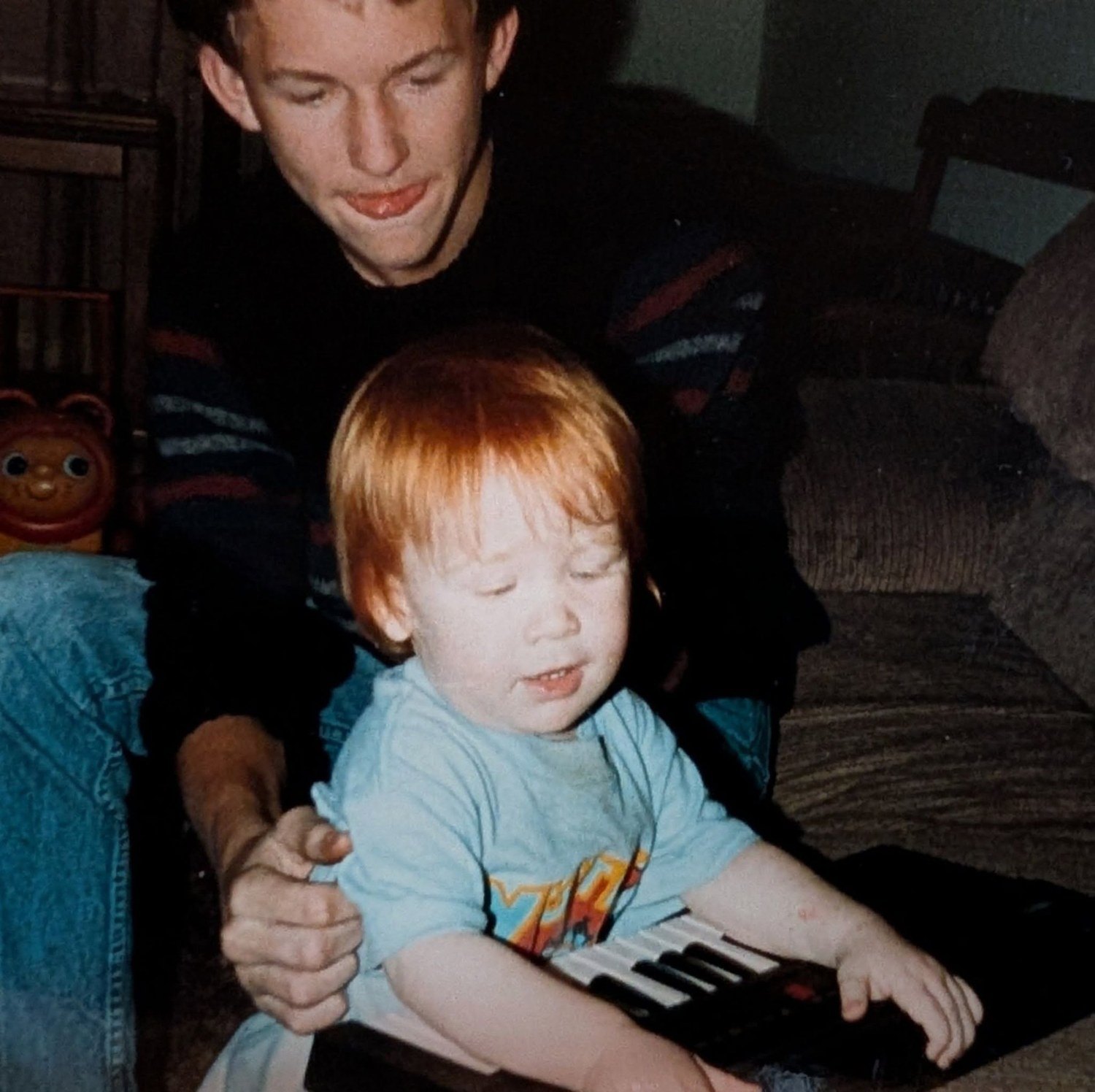 On keys, with his little brother